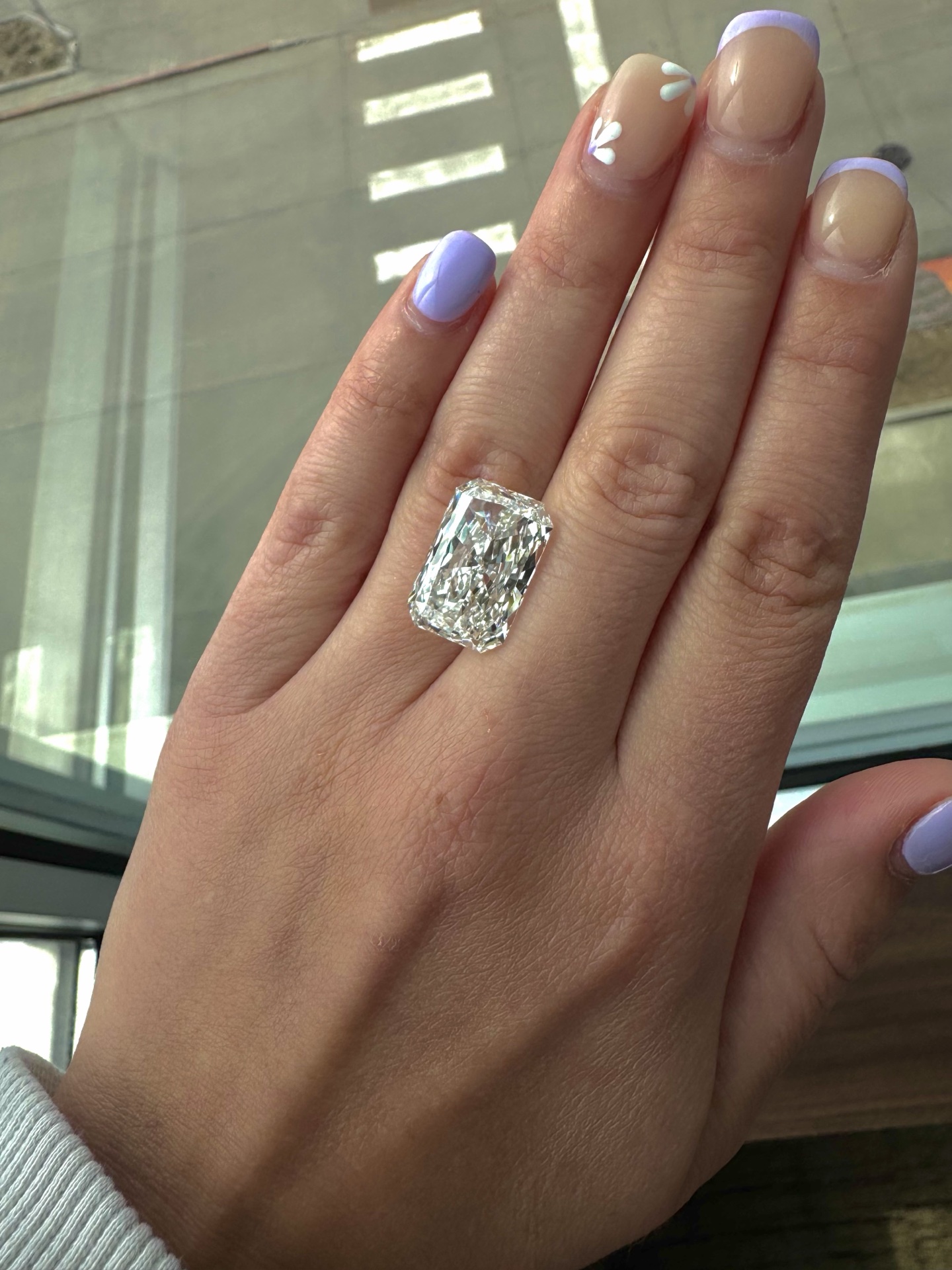 Radiant diamond ring on hand